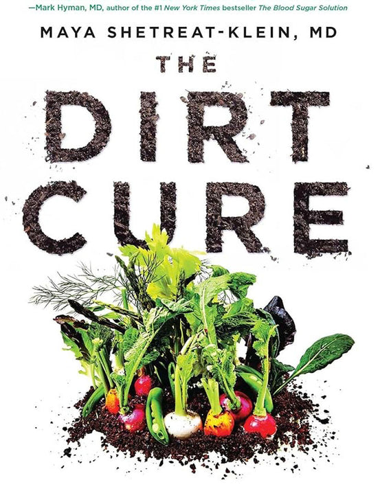 Front cover of the book The Dirt Cure showing the title formed from soil above assorted root vegetables on a white background