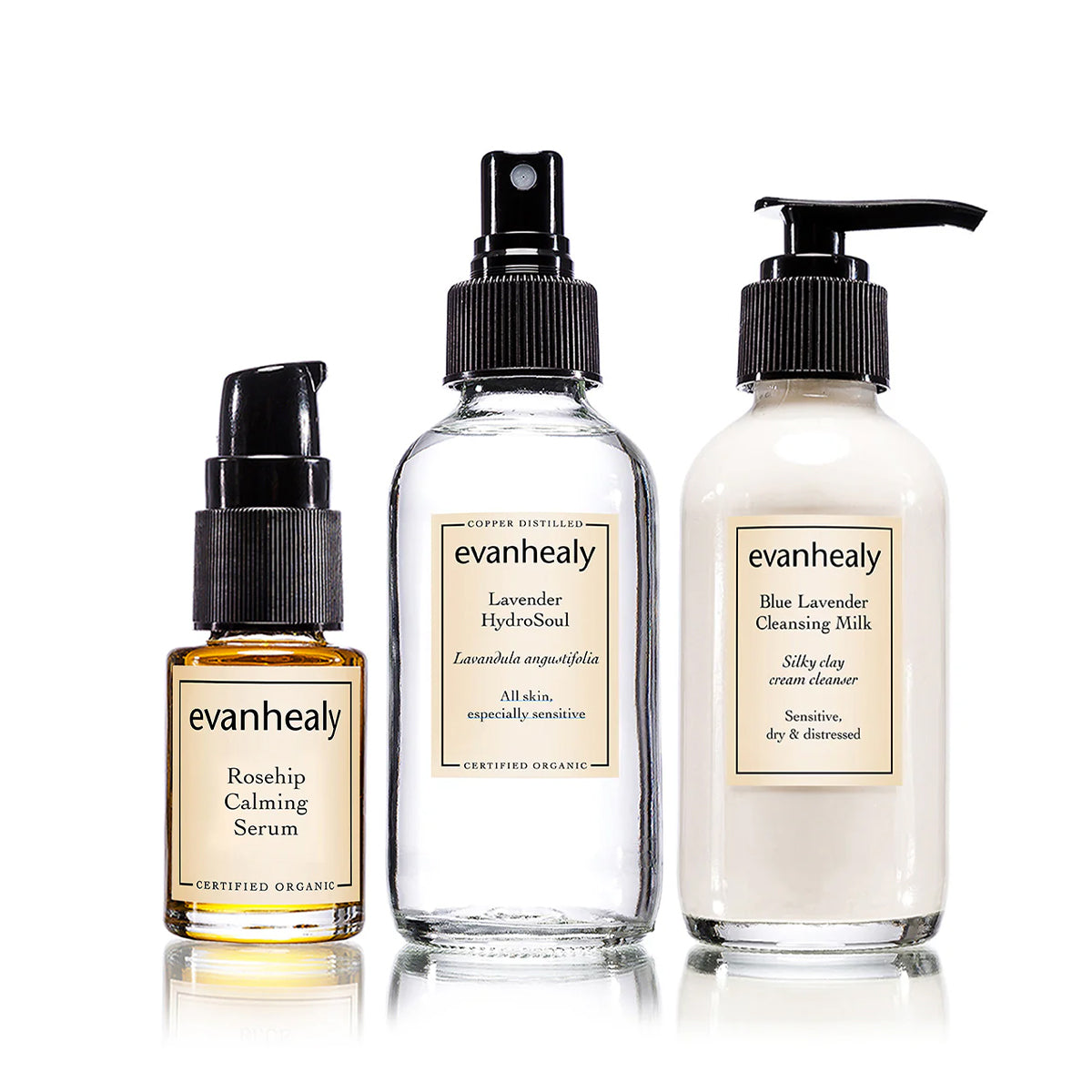 Front view of Evanhealy Calming Trio showing three bottles: serum, hydrosoul spray, and cleansing milk on white