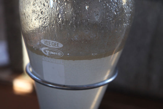 Glass distillation vessel covered in condensation during HydroSoul production