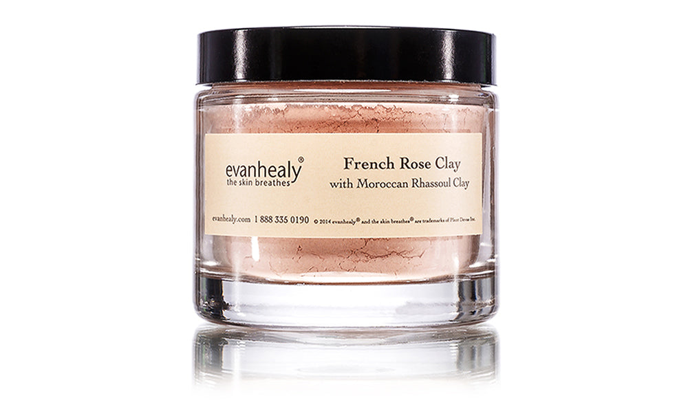 Front view of French Rose Clay jar showing pink clay in clear glass jar with black lid and label on white background