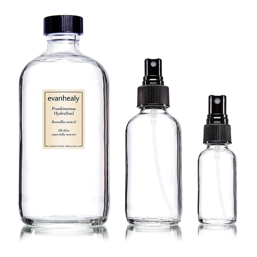 Front view of Frankincense Hydrosol Refill bottles showcasing 16 oz, 4 oz, and 1 oz sizes on a white background