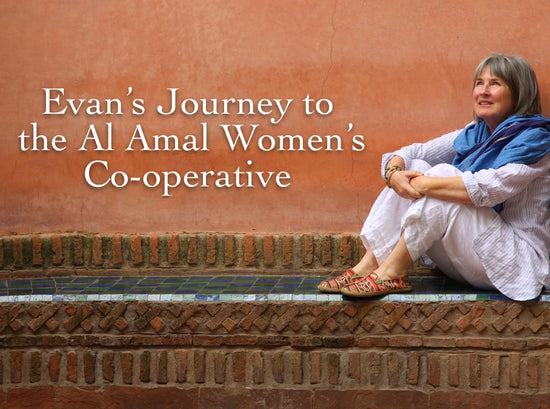 Evan seated on a tiled ledge by a terracotta wall with overlaid text Evan’s Journey to the Al Amal Women’s Co-operative