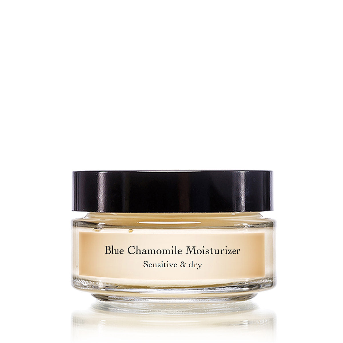 Front view of Blue Chamomile Moisturizer jar showcasing its glass container and black lid on a white background