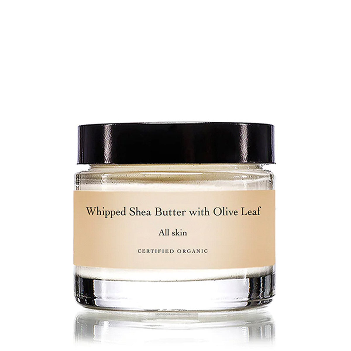 Front view of Whipped Shea Butter with Olive Leaf facial moisturizer in a glass jar with a black lid on a white background