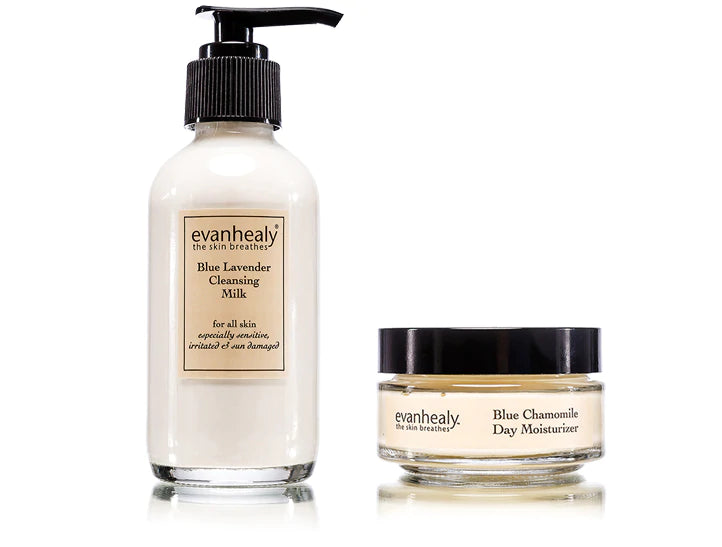 Front view of Blue Lavender Cleansing Milk pump bottle and Blue Chamomile Day Moisturizer jar with labels on white background