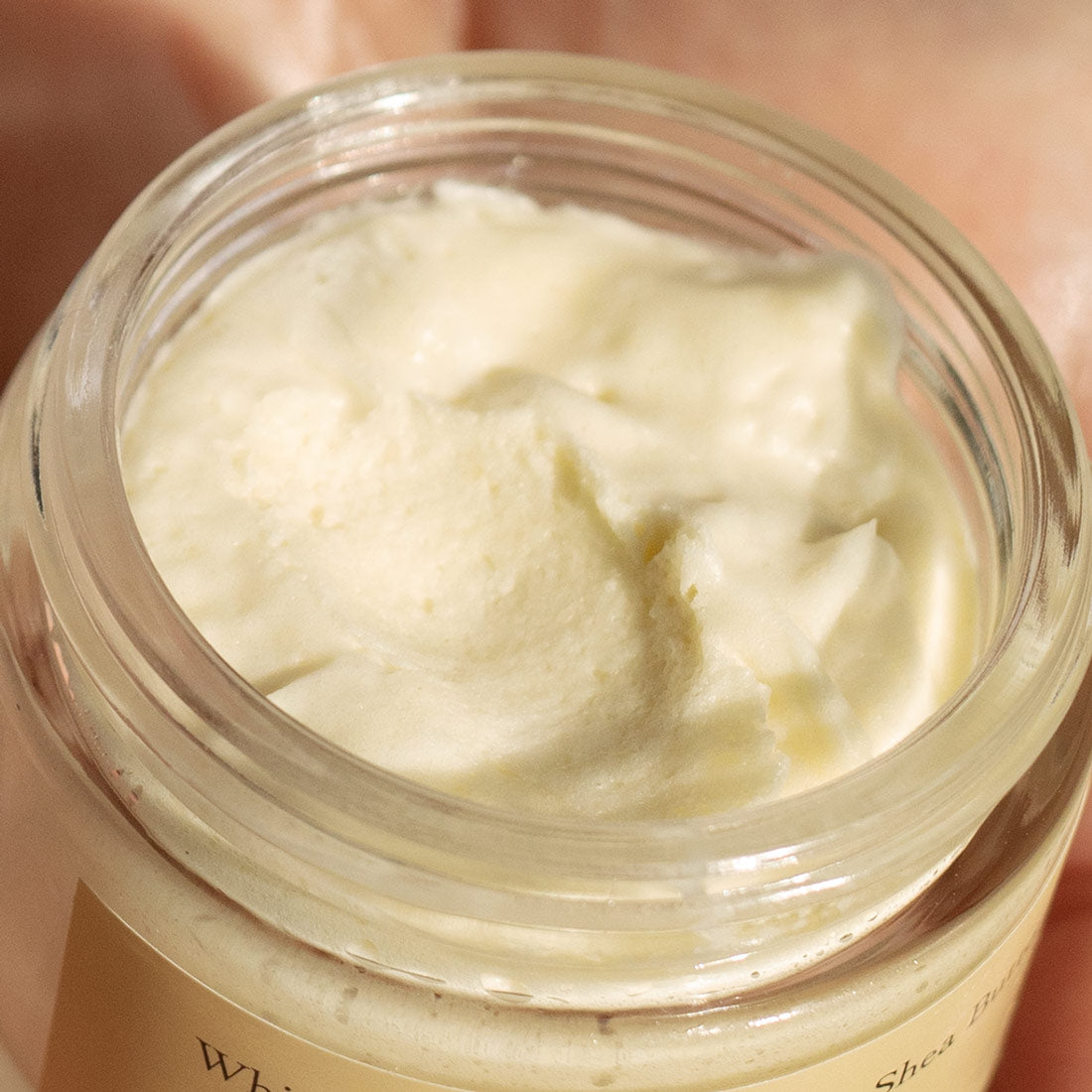 open jar of whipped patchouli vanilla shea butter