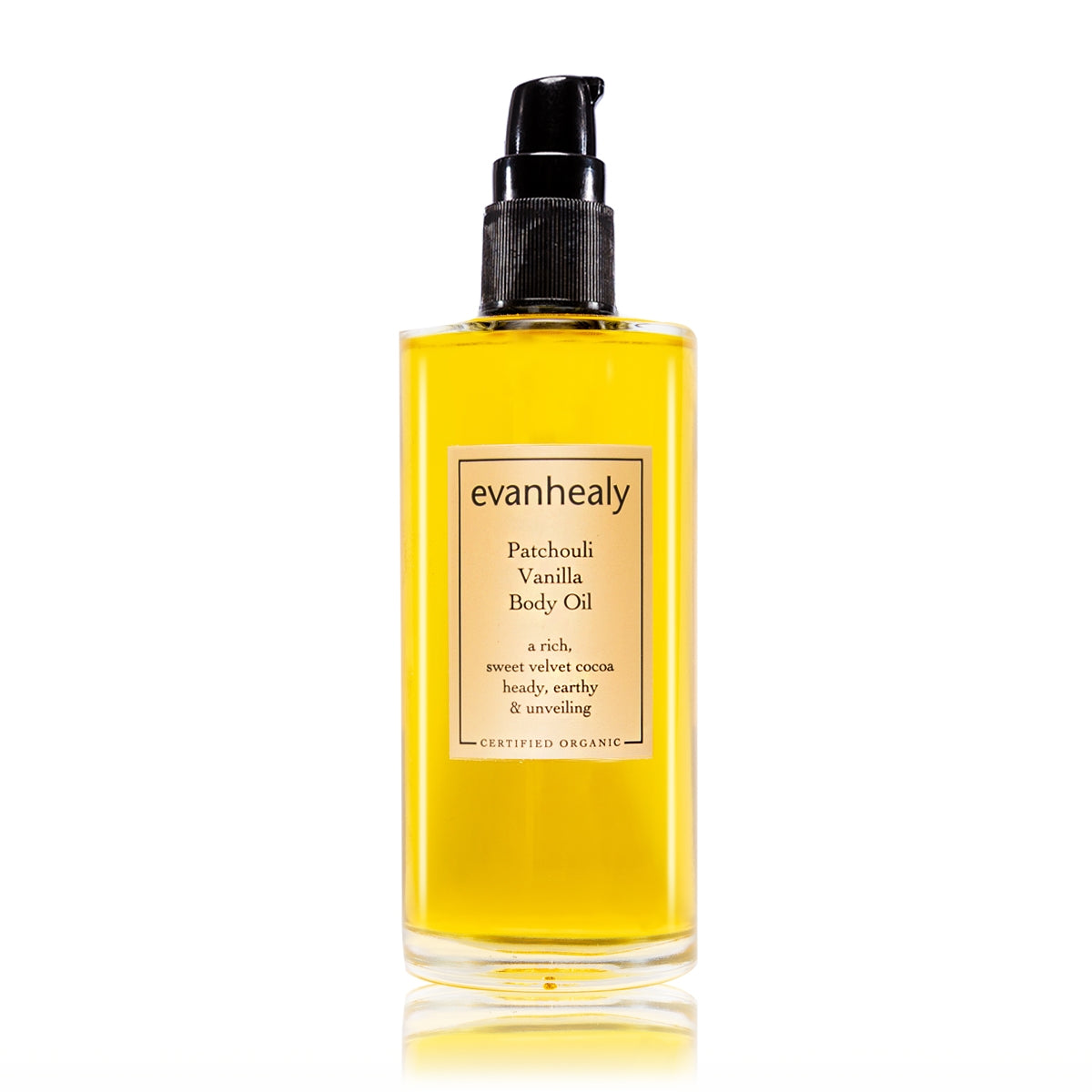 Front view of evanhealy Patchouli Vanilla Body Oil bottle showcasing yellow oil and pump top on white background